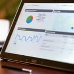 Market researcher analyzing YouTube channel data and competitor insights using transcript analysis dashboard